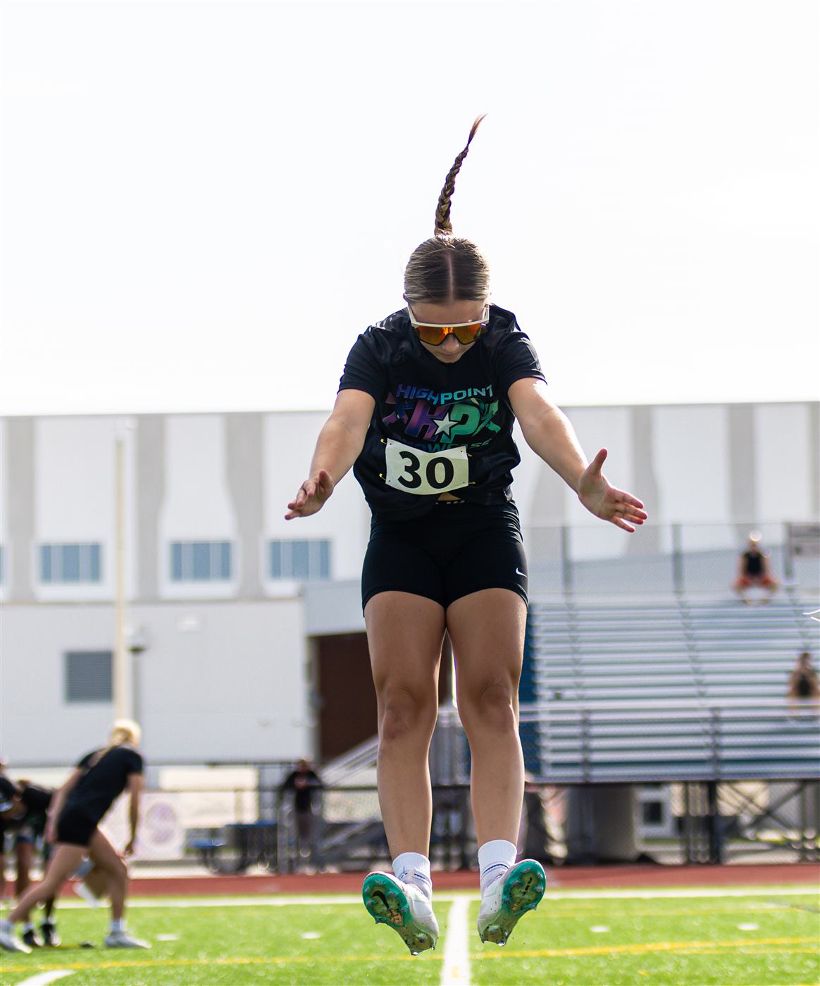 Athlete mid-air during the broad jump