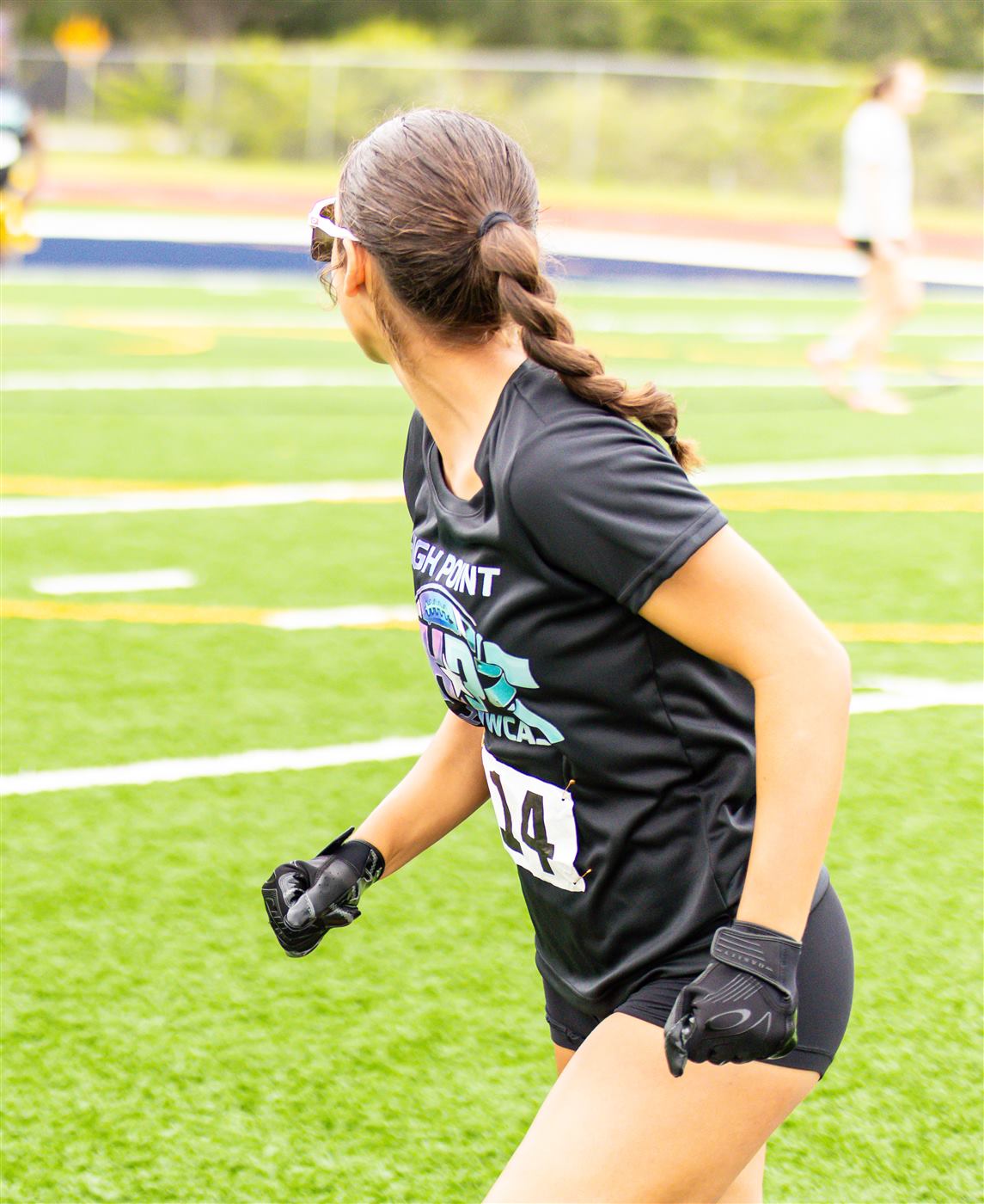 Athletes running a coverage drill
