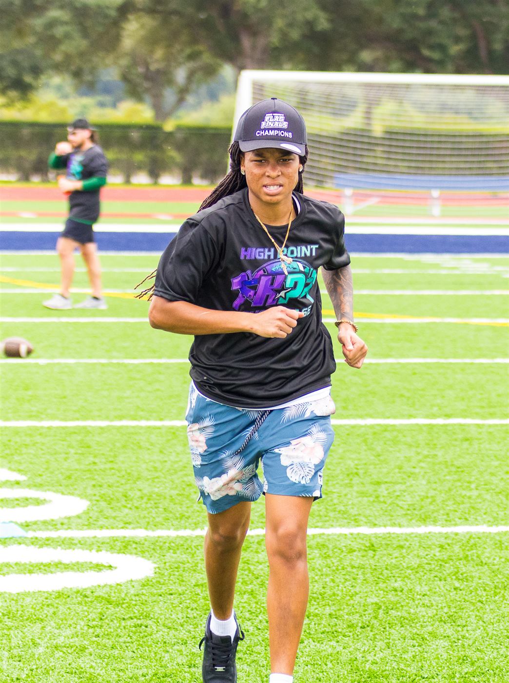 Coach on the field during the showcase
